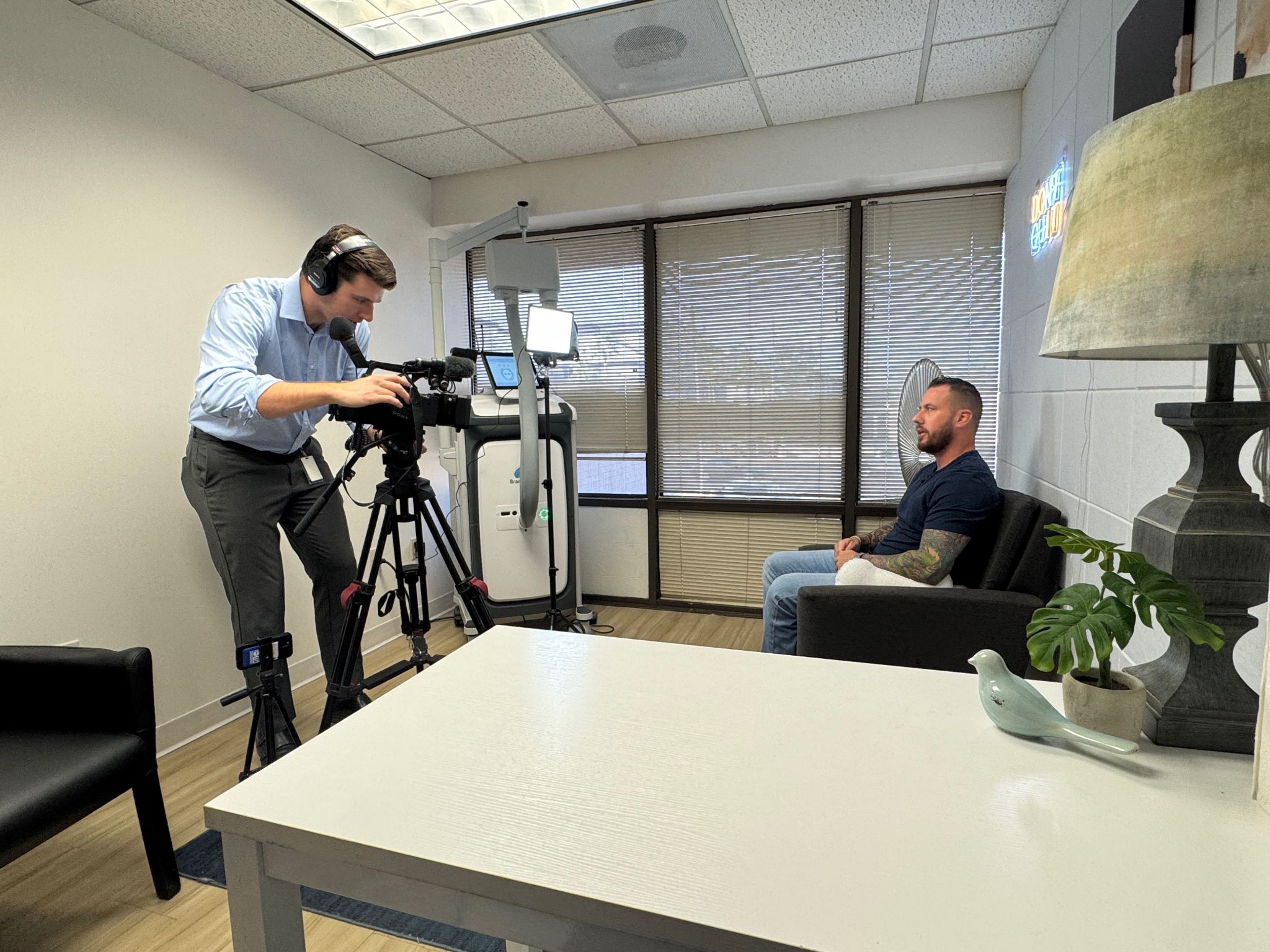 Dr. Robbie Westerman seated during a clinic media interview